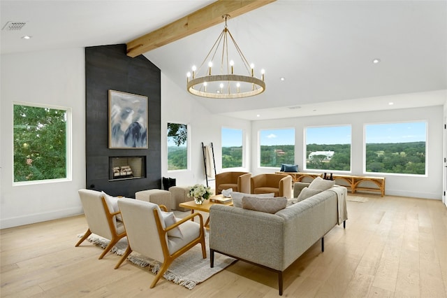 living room featuring light wood-type flooring, visible vents, beamed ceiling, and an inviting chandelier