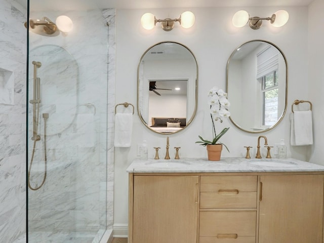 bathroom featuring vanity and an enclosed shower