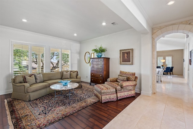 living room featuring hardwood / wood-style flooring and ornamental molding