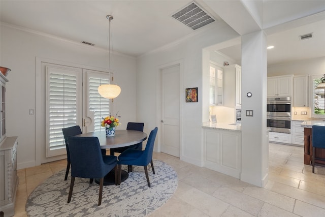 dining space featuring ornamental molding