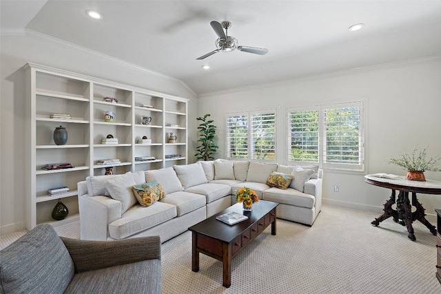 carpeted living room with ceiling fan, lofted ceiling, and ornamental molding