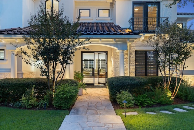 entrance to property featuring french doors