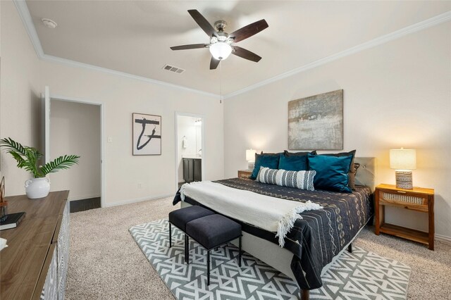 carpeted bedroom with crown molding, ensuite bathroom, and ceiling fan