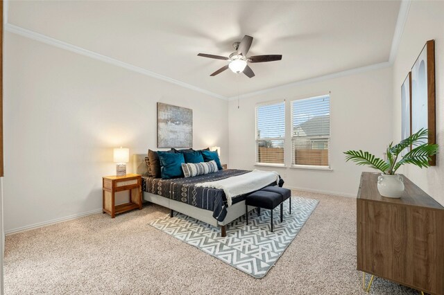 bedroom featuring crown molding, carpet flooring, and ceiling fan