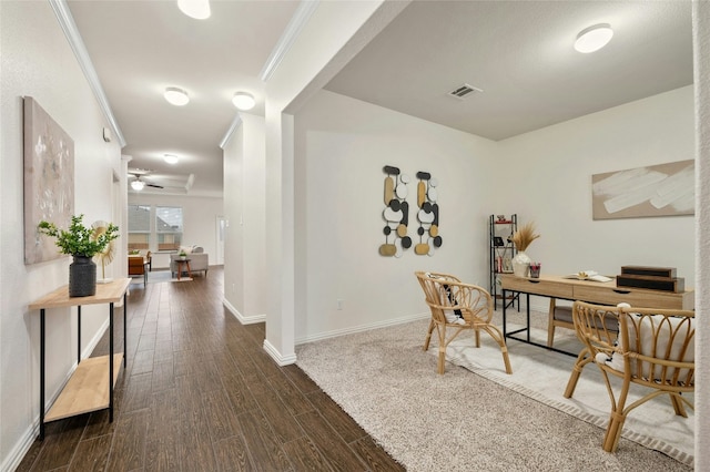 office with dark wood-type flooring, ceiling fan, and ornamental molding