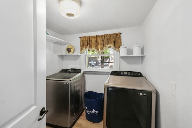 laundry area with washing machine and dryer