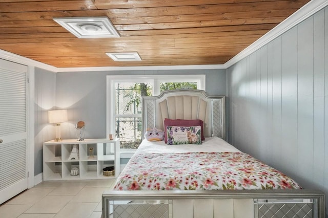 tiled bedroom featuring wood ceiling, wood walls, and ornamental molding