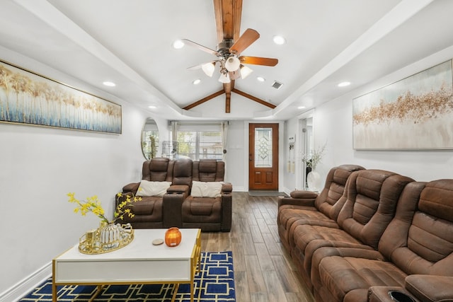 living room with hardwood / wood-style floors, ceiling fan, and lofted ceiling