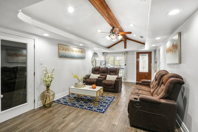 living room with lofted ceiling with beams, ceiling fan, and wood-type flooring