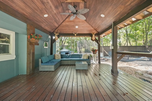 wooden deck with a gazebo, ceiling fan, and an outdoor hangout area