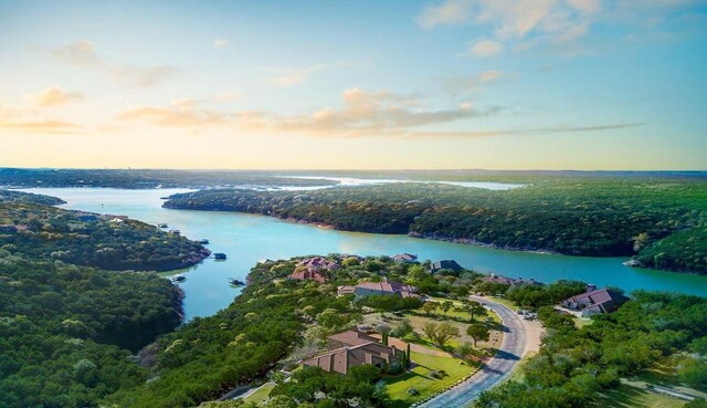 aerial view at dusk with a water view