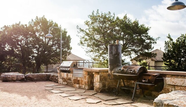 view of patio / terrace with an outdoor kitchen and area for grilling