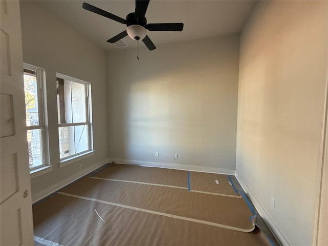 unfurnished room with ceiling fan