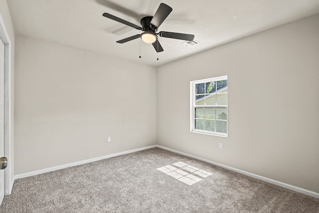 carpeted empty room with ceiling fan