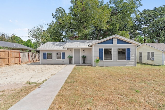 ranch-style house featuring a front lawn