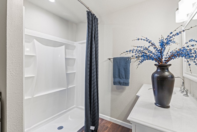 bathroom featuring a shower with curtain and wood-type flooring