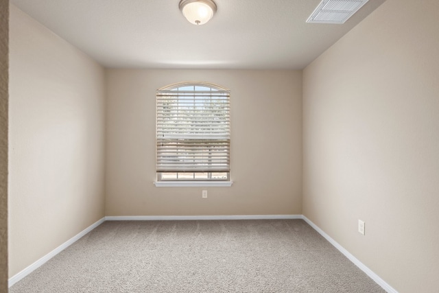 spare room with carpet floors