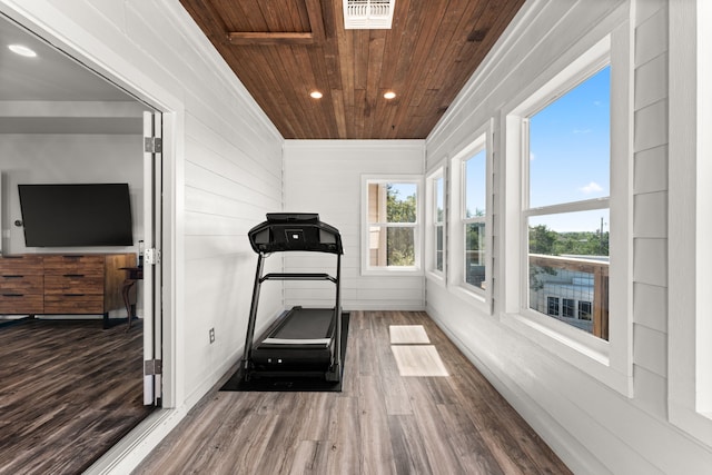 workout area featuring wood-type flooring and wood ceiling