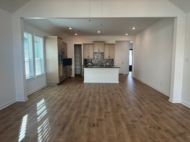 kitchen featuring vaulted ceiling and a healthy amount of sunlight