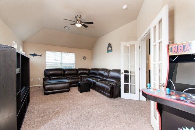 living room featuring light carpet, lofted ceiling, french doors, and ceiling fan