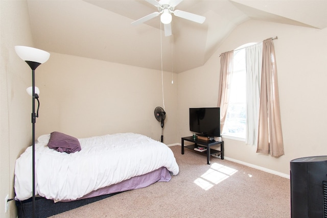 carpeted bedroom featuring ceiling fan and vaulted ceiling