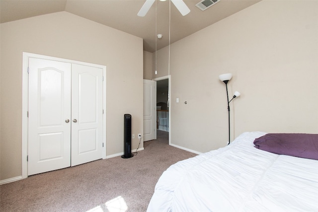 carpeted bedroom featuring lofted ceiling, ceiling fan, and a closet