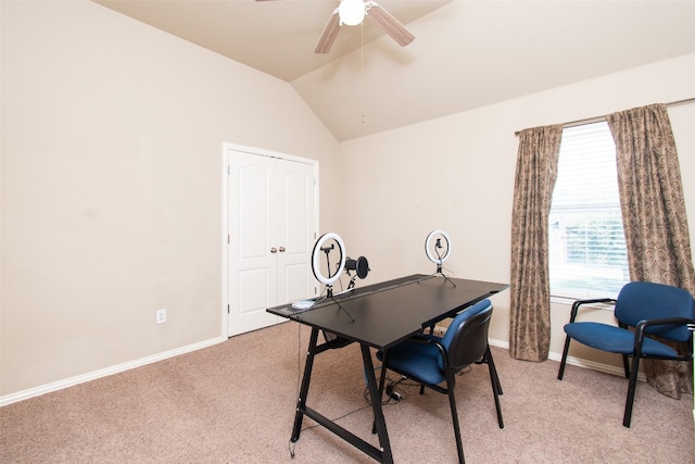 office area featuring light carpet, vaulted ceiling, and ceiling fan