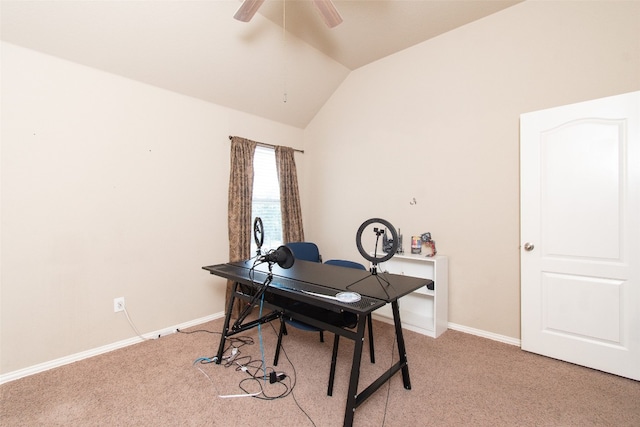 carpeted home office with ceiling fan and lofted ceiling