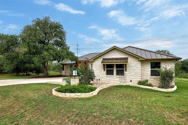 1323 Hi Cir N, Horseshoe Bay, TX 78657 - ranch-style home featuring stone siding, a front lawn, metal roof, and a standing seam roof