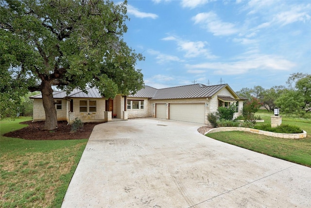 1323 Hi Cir N, Horseshoe Bay, TX 78657 - ranch-style house with stone siding, a garage, concrete driveway, a standing seam roof, and a front yard