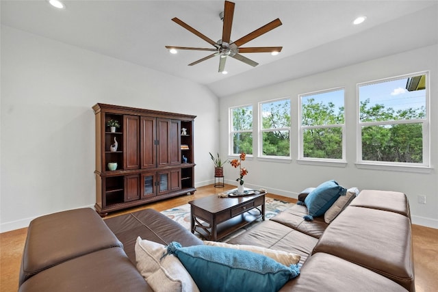 living room with light hardwood / wood-style flooring, vaulted ceiling, and ceiling fan