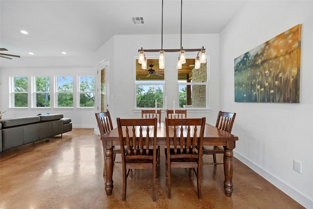 dining room featuring concrete floors and ceiling fan