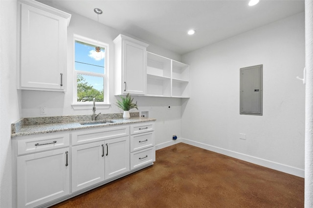 1323 Hi Cir N, Horseshoe Bay, TX 78657 - laundry room with electric panel, electric dryer hookup, hookup for a washing machine, baseboards, and recessed lighting