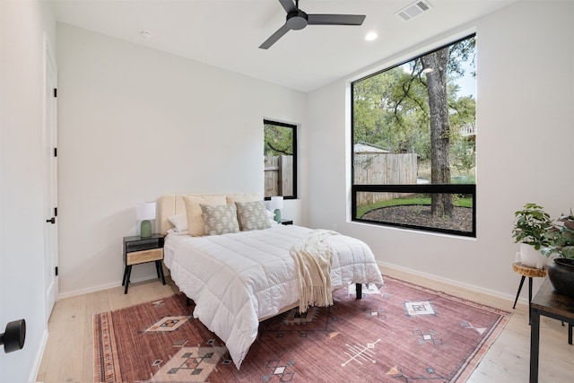 bedroom featuring ceiling fan and light hardwood / wood-style flooring