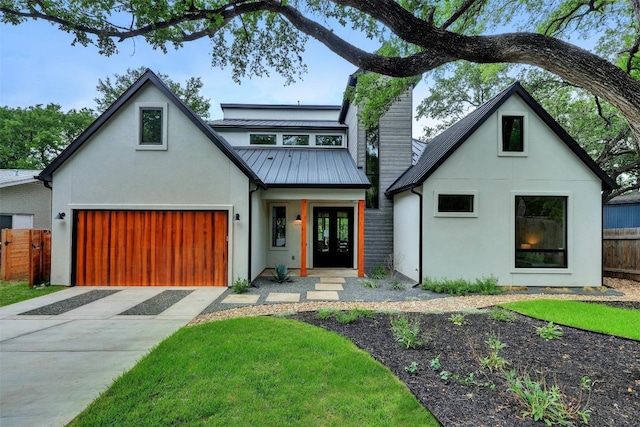 modern inspired farmhouse with french doors and a garage