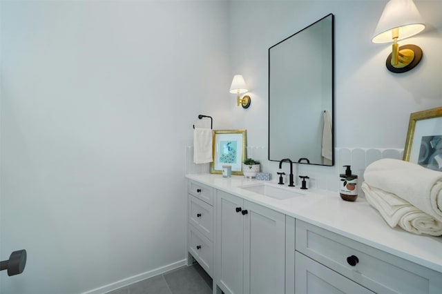 bathroom with tile patterned floors and vanity