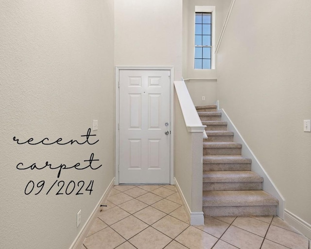 110 Dogwood Dr, Georgetown, TX 78626 - foyer with light tile patterned floors, baseboards, and stairway