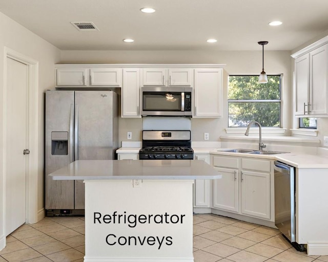 kitchen featuring visible vents, a sink, white cabinetry, appliances with stainless steel finishes, and light countertops