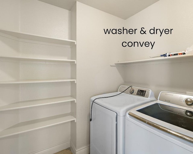 laundry room featuring laundry area, baseboards, and separate washer and dryer