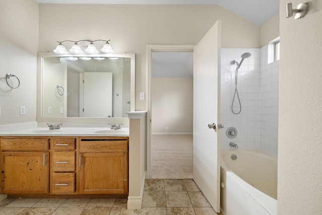 full bath with double vanity, washtub / shower combination, lofted ceiling, and a sink