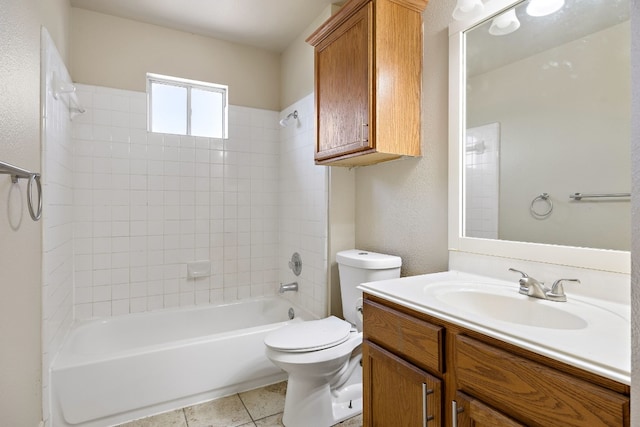 bathroom featuring vanity, shower / washtub combination, tile patterned floors, toilet, and a textured wall