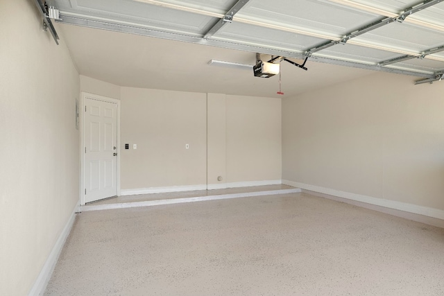 garage with baseboards and a garage door opener