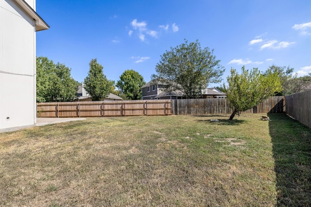 view of yard with a fenced backyard