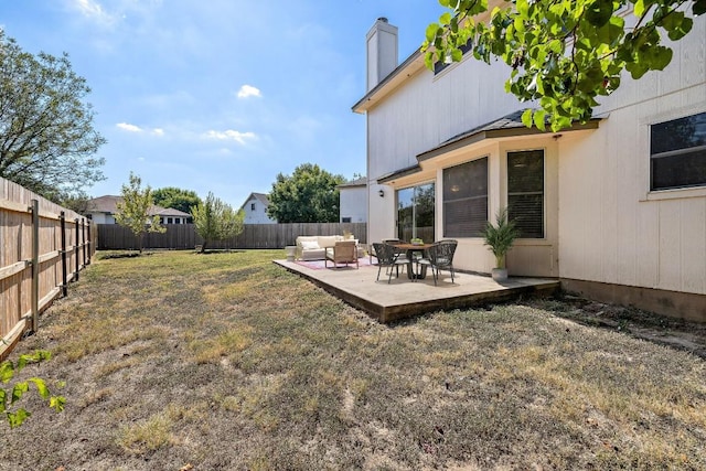 view of yard featuring a patio area, outdoor lounge area, and a fenced backyard