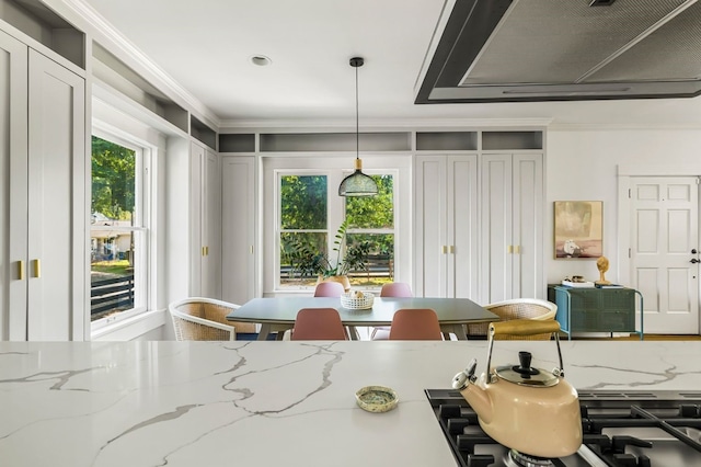 dining area featuring crown molding