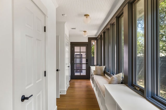 interior space with dark wood-style flooring and visible vents