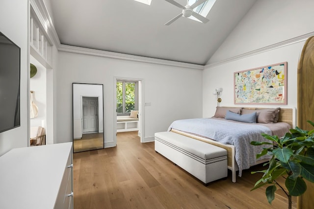bedroom featuring high vaulted ceiling, ceiling fan, and light wood-type flooring