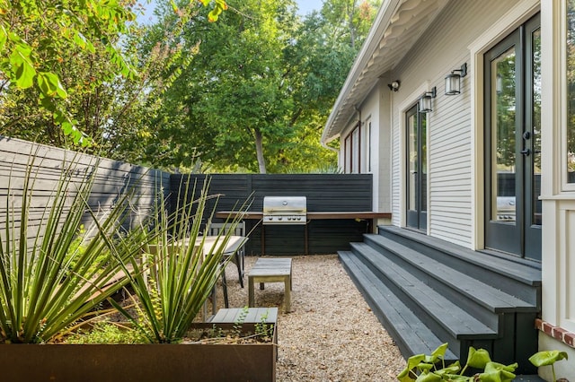 view of yard featuring a fenced backyard and entry steps