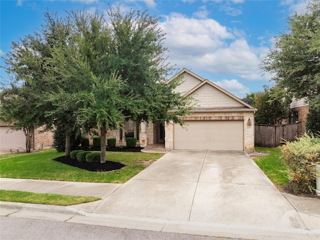 view of front of property with a front yard and a garage