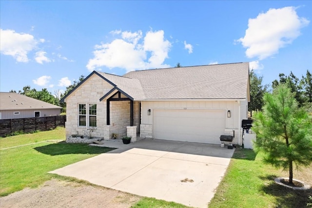 ranch-style home featuring a garage and a front yard